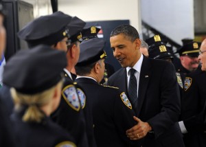 US President Barack Obama greets police officers at the First Precinct police station in lower Manhattan in New York on May 5, 2011. Obama will participate in a wreath laying ceremony at the 9/11 Memorial. Obama was Thursday braced for a "bittersweet" visit to Ground Zero after the killing of Osama bin Laden, but felt it was important to go to offer "closure" to Americans. AFP PHOTO/Jewel Samad (Photo credit should read JEWEL SAMAD/AFP/Getty Images)